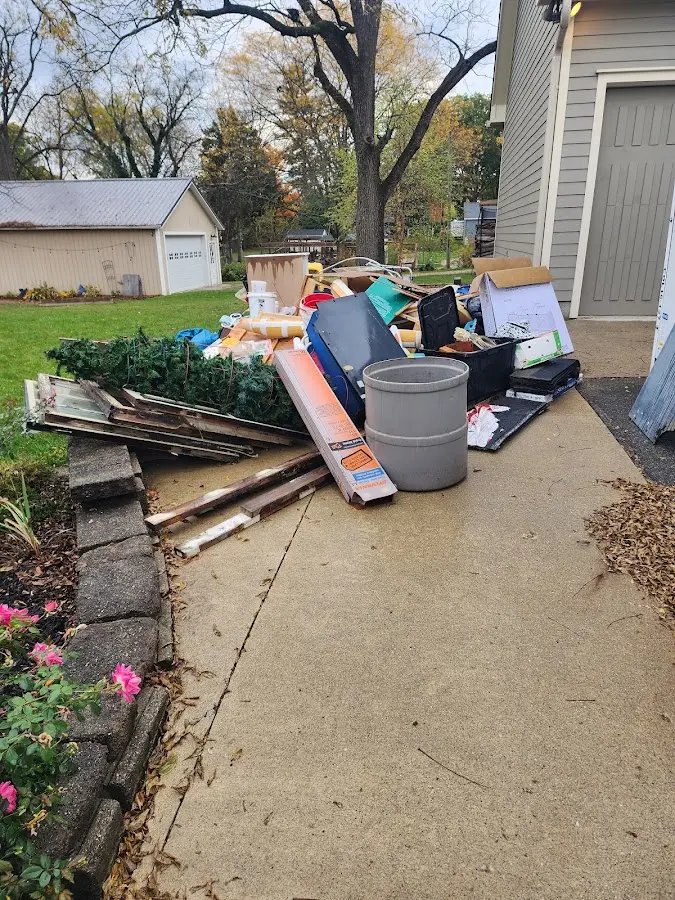 Dumpster being loaded with debris for Estate Cleanout Dumpster Rental in Richmond